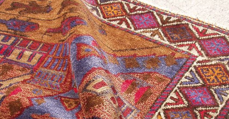 How to Keep a Rug from Bunching Up on Carpet